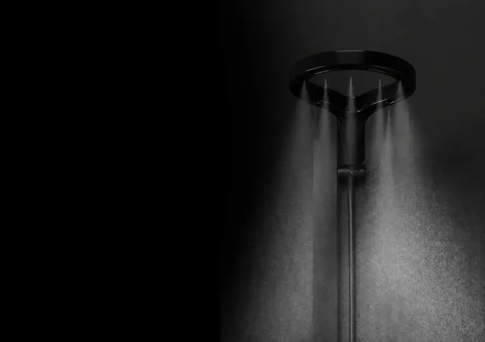 Olsek Halo delivering wide overhead cold-water coverage in a dark shower